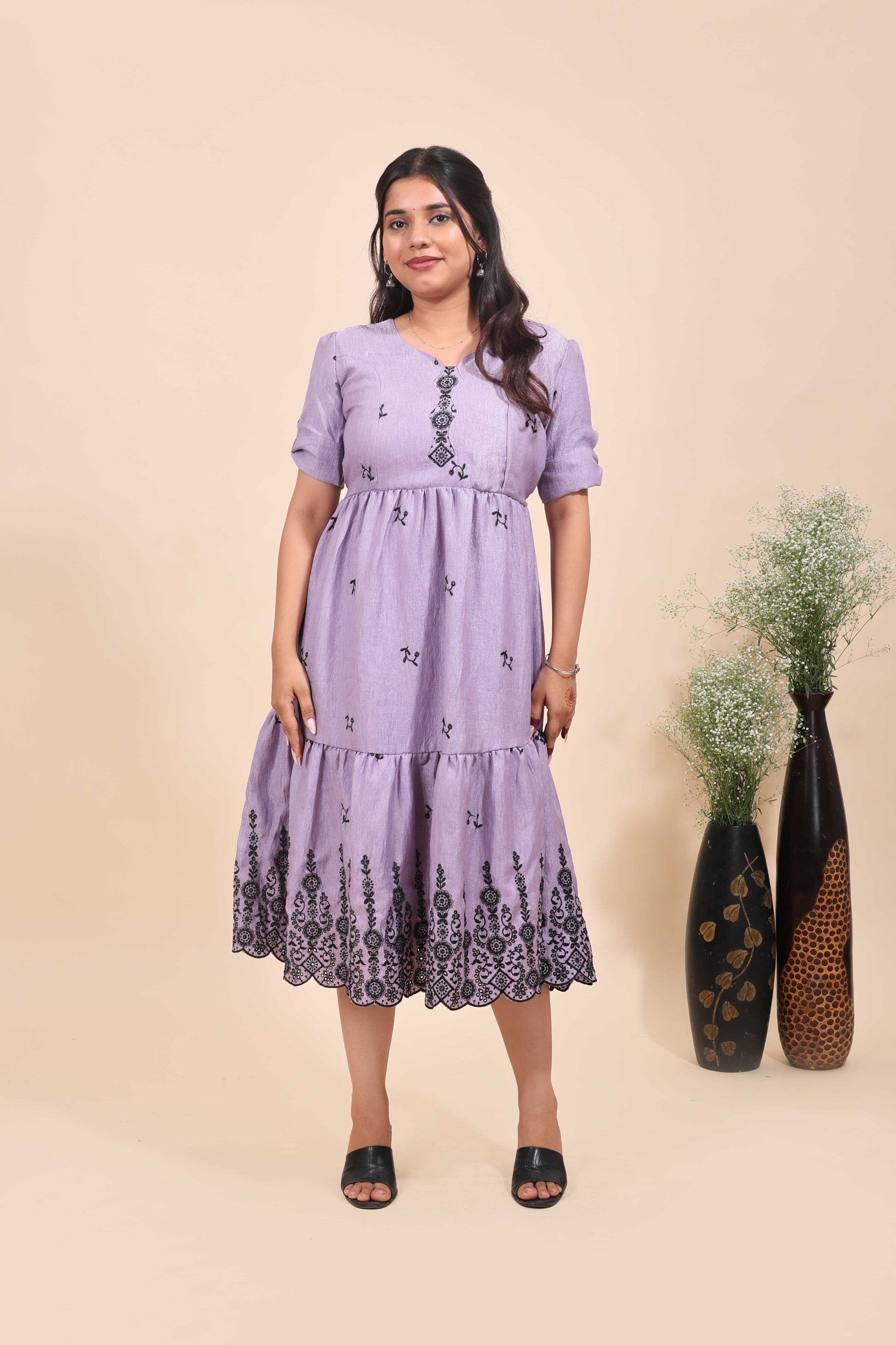 This is a maxi drees featuring black floral embroidery