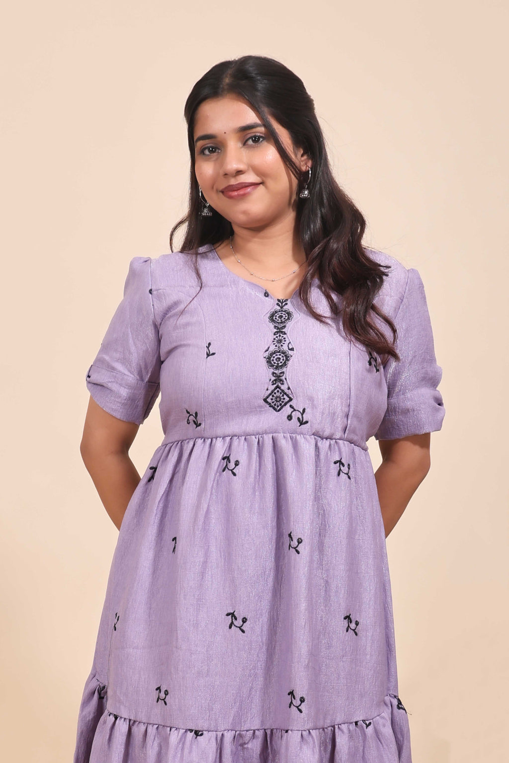 This is a maxi drees featuring black floral embroidery