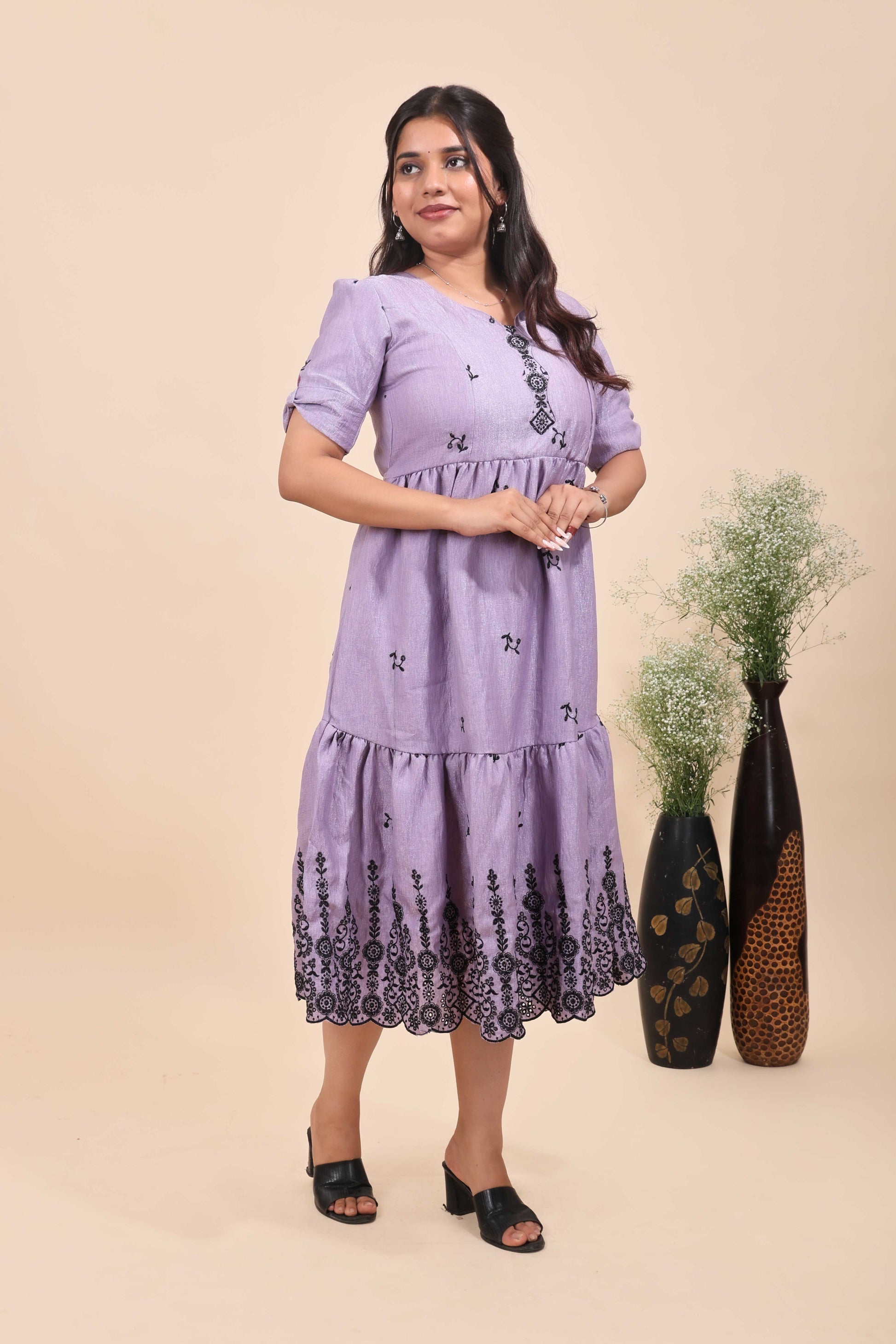 This is a maxi drees featuring black floral embroidery