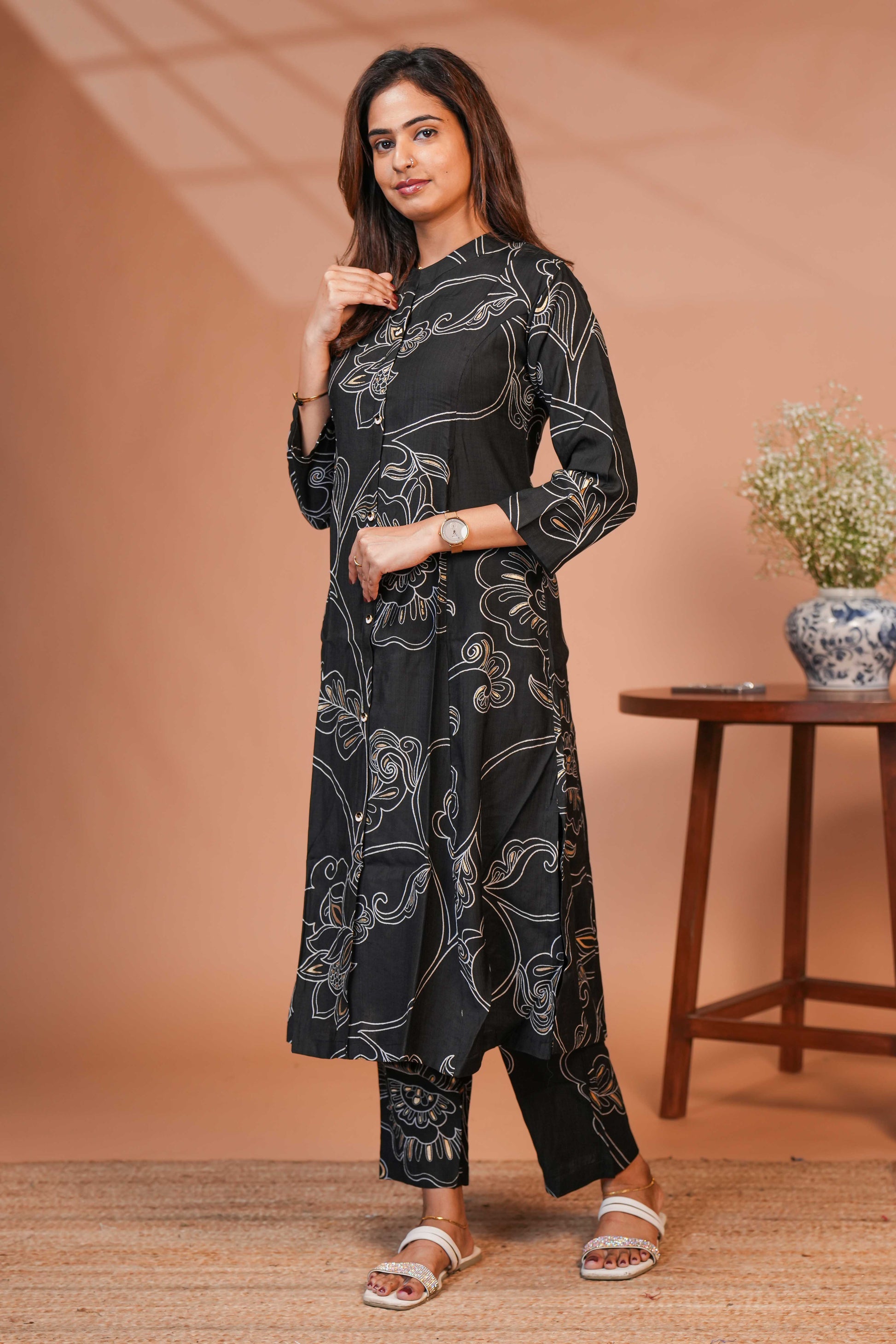 The Model is Wearing a Contemporary Two-Piece Ethnic Co-Ord Set in a Deep Midnight Black.