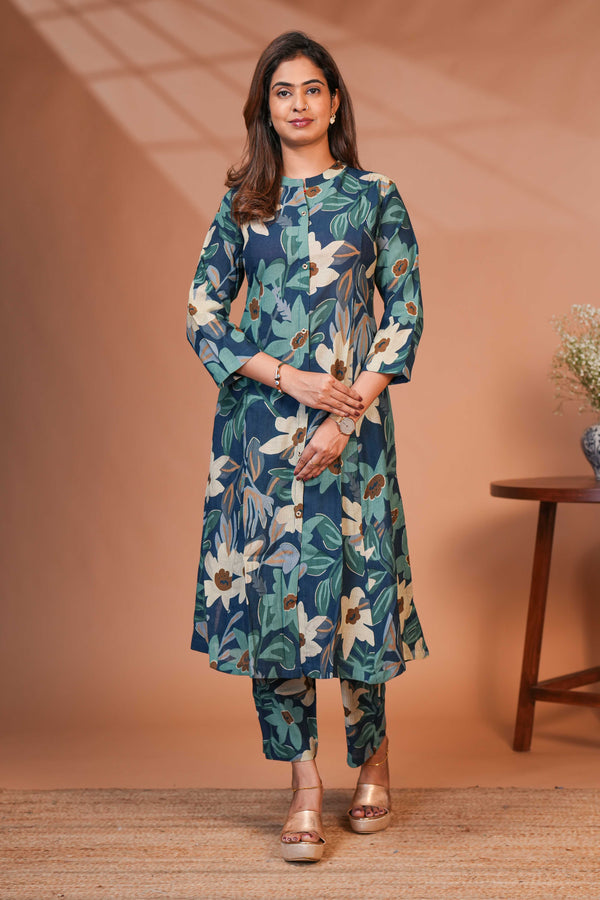 A Calf-Length Tunic Featuring a Structured Mandari A Rich Deep Teal-Blue Base,