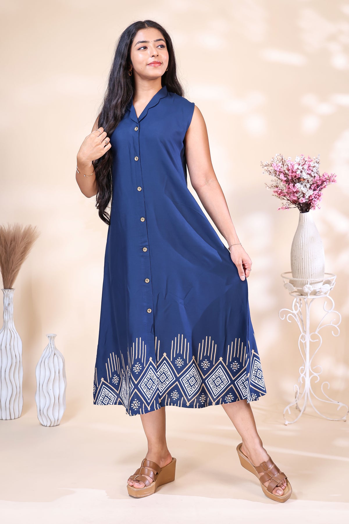 Elegant Navy Blue Dress with Geometric Hem Print
