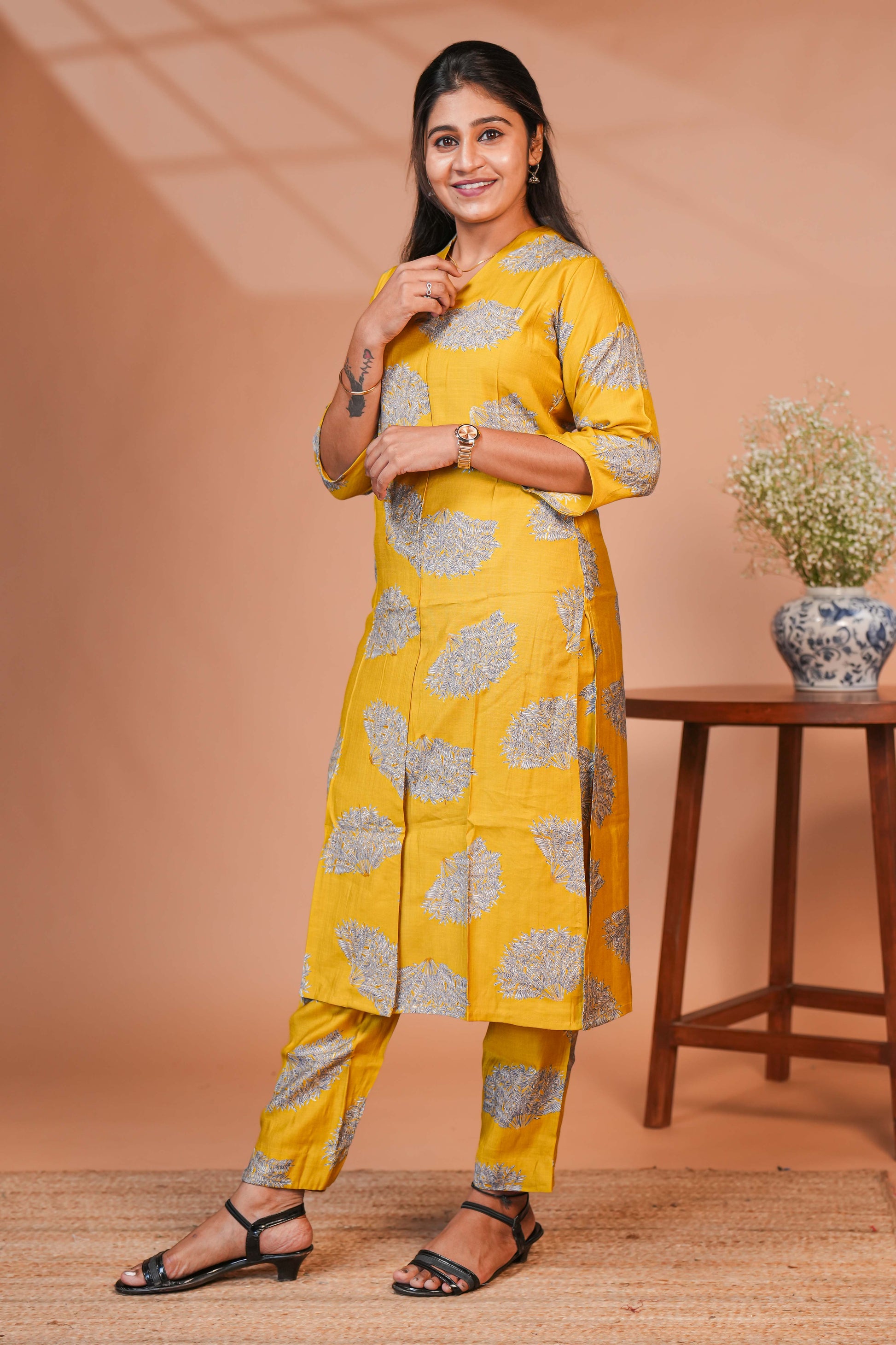 Coordinated Kurta–Pant Set  Color: Mustard Yellow Base With Silver-Grey Floral Block Print  Kurta: