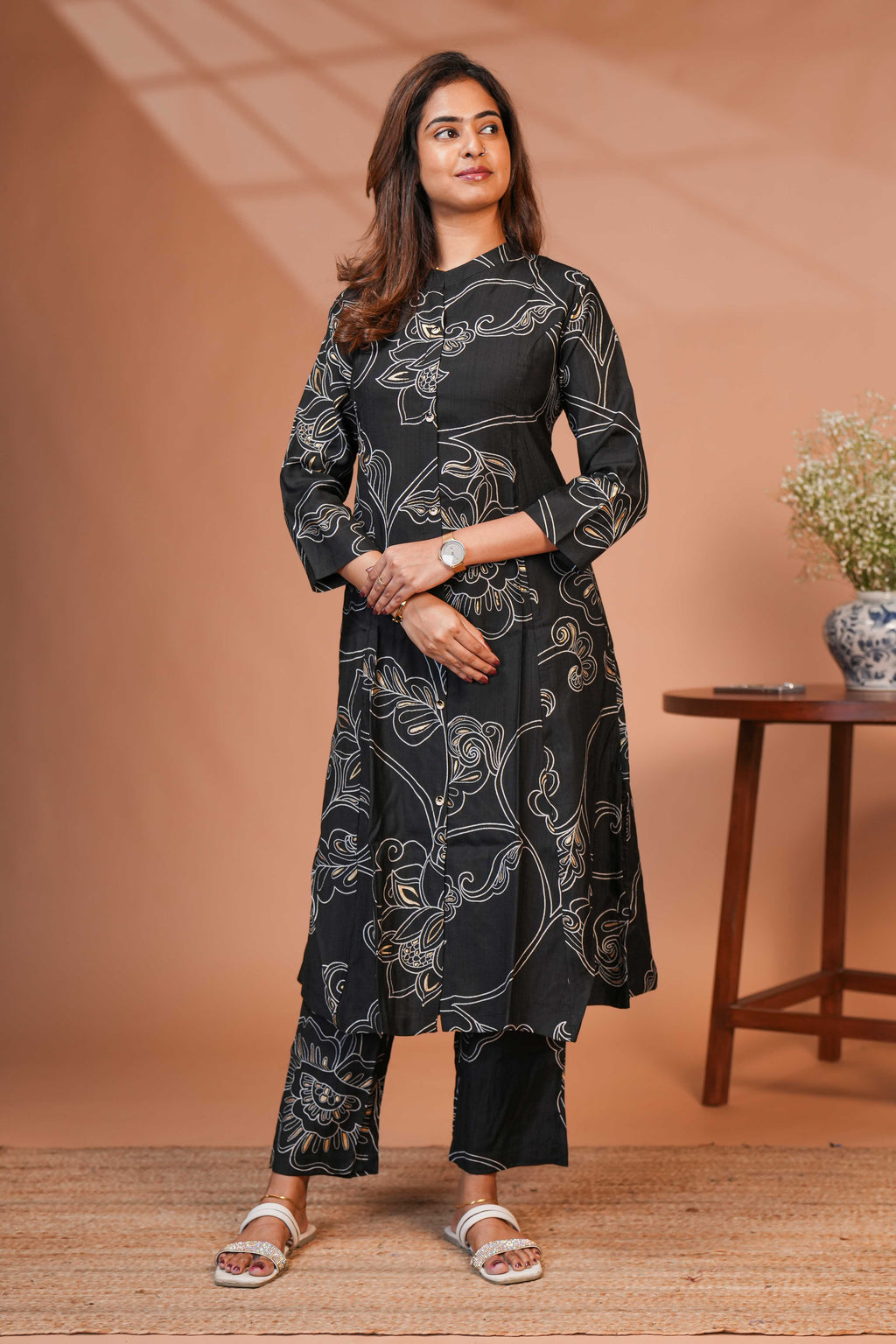 The Model is Wearing a Contemporary Two-Piece Ethnic Co-Ord Set in a Deep Midnight Black.