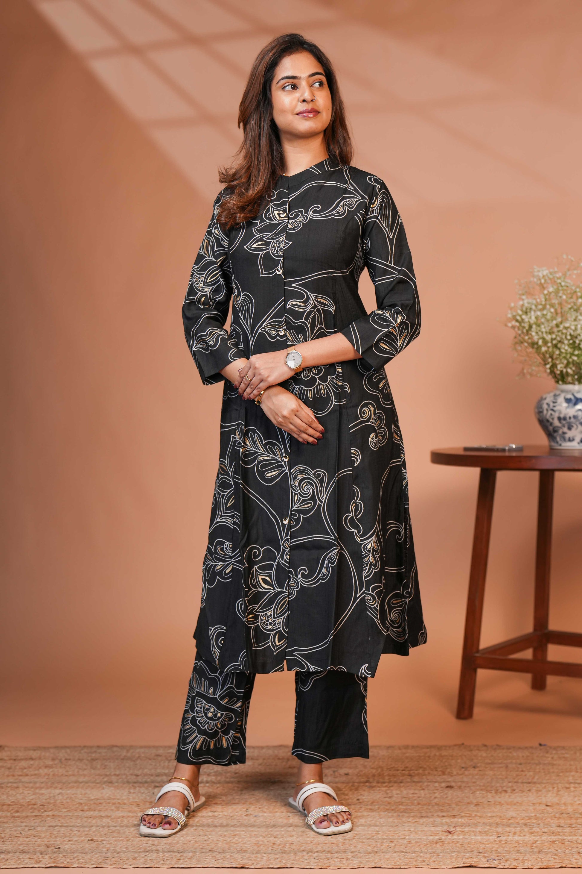 The Model is Wearing a Contemporary Two-Piece Ethnic Co-Ord Set in a Deep Midnight Black.