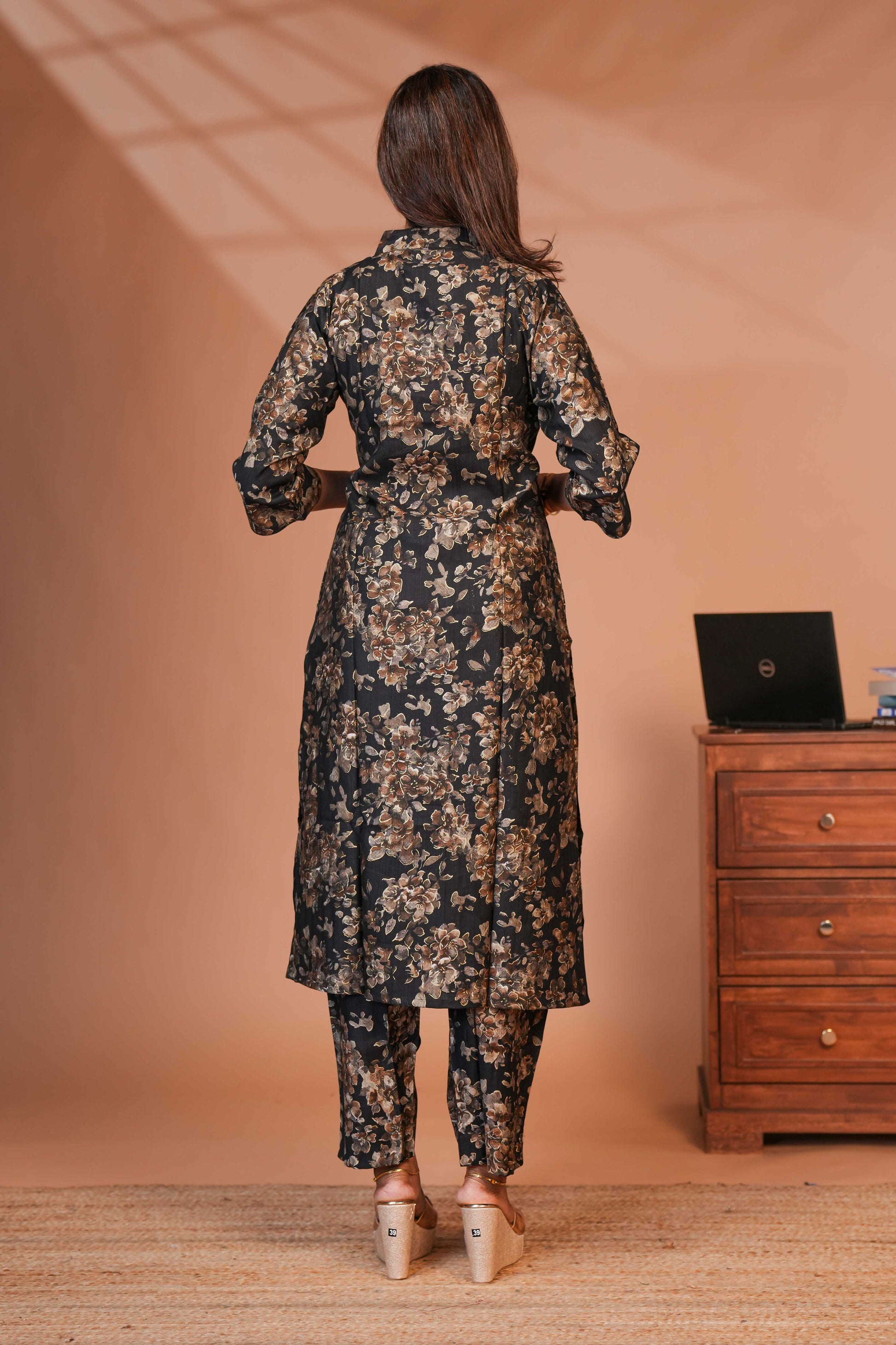 A Woman Wearing a Co-ordinated Floral Kurta–Pant Set With a Modern Ethnic Style