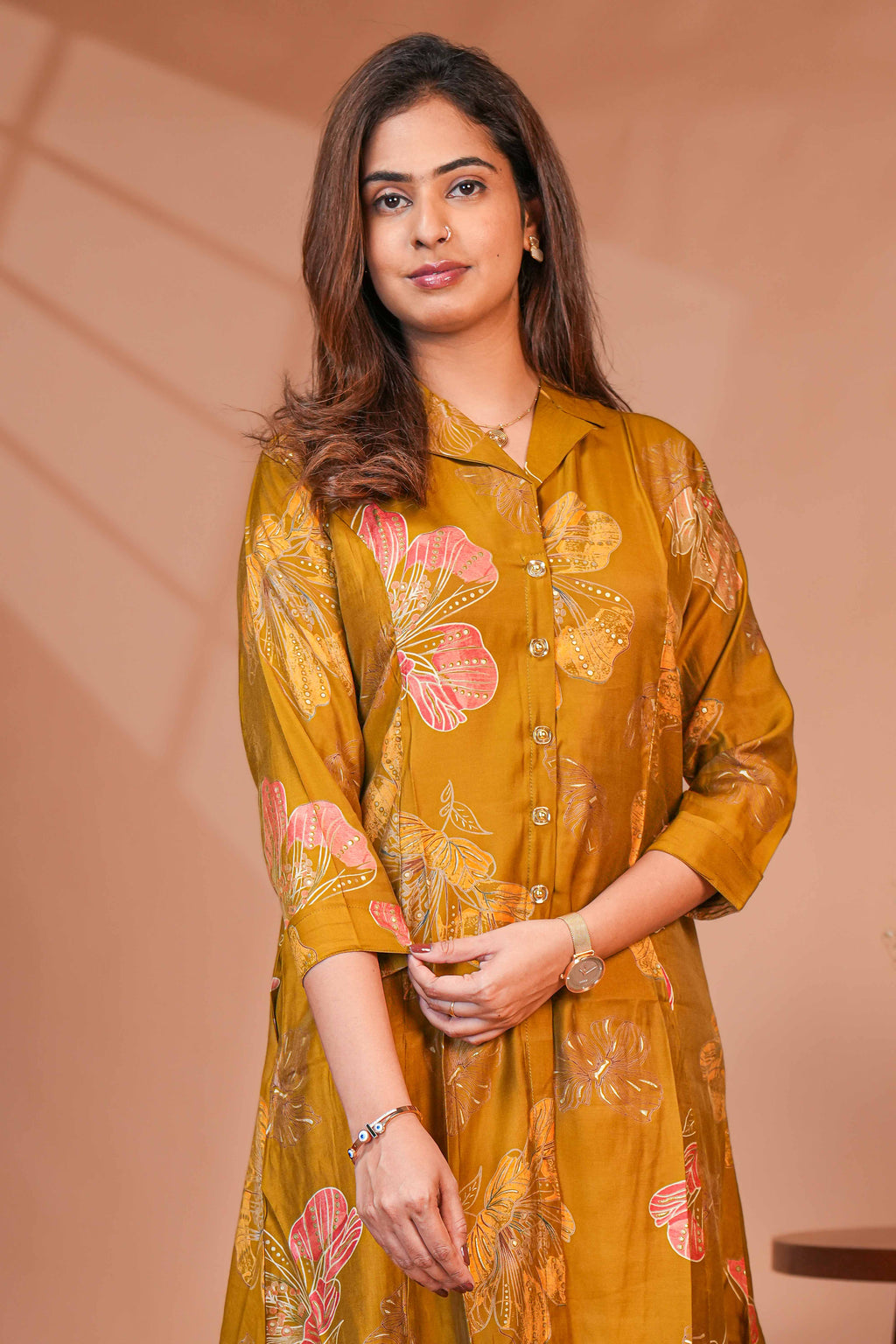 A-Line Cut Ensures a Flattering Fit That Transitions Leaf Clusters and Sunflower Patterns in Gold and Cream Kurti