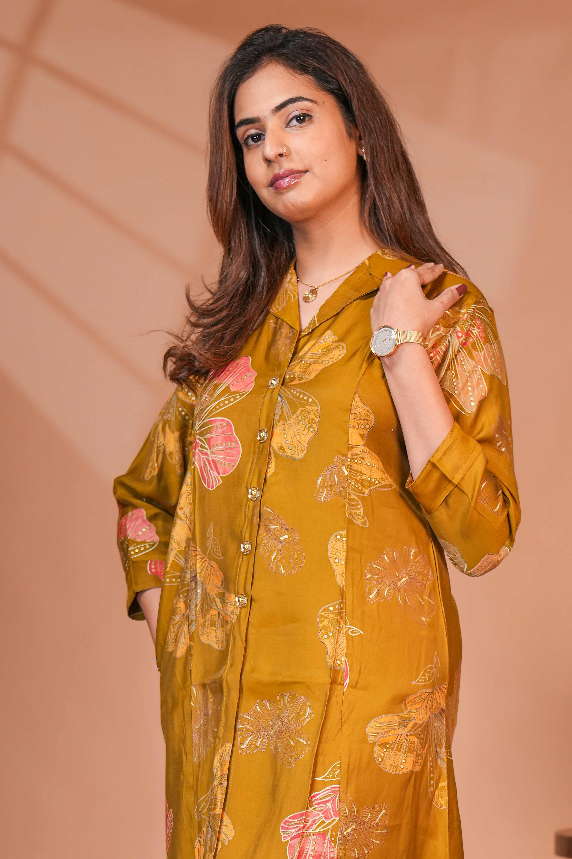 A-Line Cut Ensures a Flattering Fit That Transitions Leaf Clusters and Sunflower Patterns in Gold and Cream Kurti