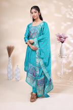Front view of elegant teal blue embroidered three piece suit for women